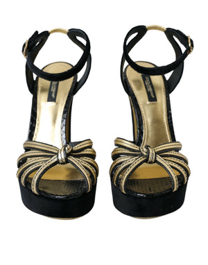 Schwarze, goldene Sandalen mit Verzierungen und Absatz