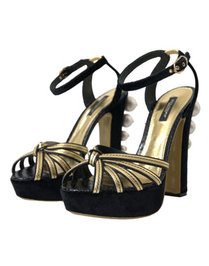 Schwarze, goldene Sandalen mit Verzierungen und Absatz
