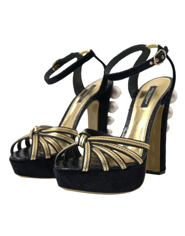 Schwarze, goldene Sandalen mit Verzierungen und Absatz