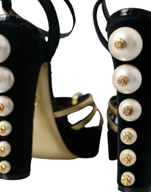 Schwarze, goldene Sandalen mit Verzierungen und Absatz