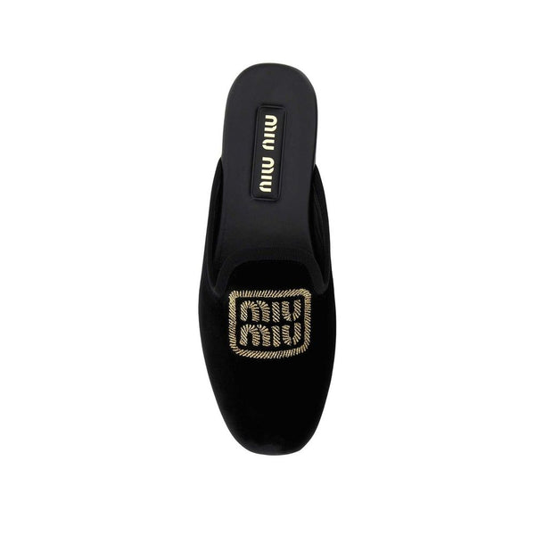 Schwarze Mules aus Kalbsleder
