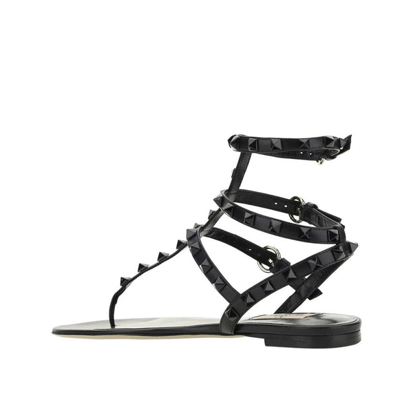 Flache Sandalen aus schwarzem Kalbsleder