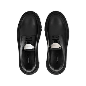 Schwarze Oxford- und Derby-Schuhe aus Kalbsleder