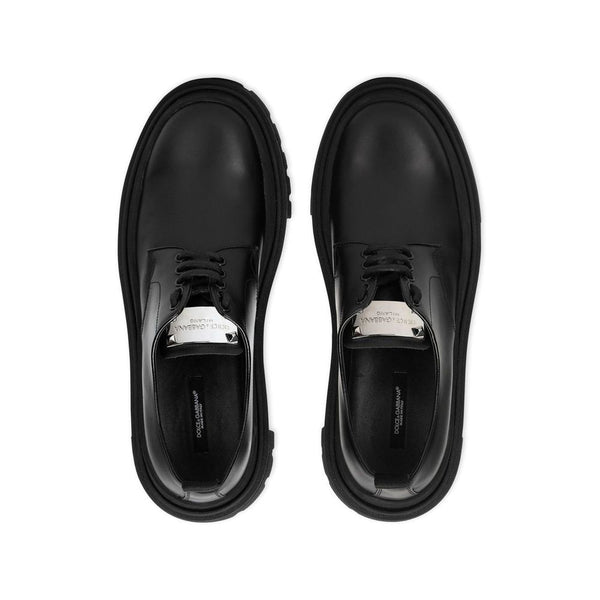 Schwarze Oxford- und Derby-Schuhe aus Kalbsleder