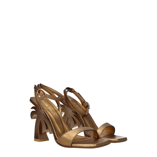 Goldene Ledersandalen mit Plateauabsatz