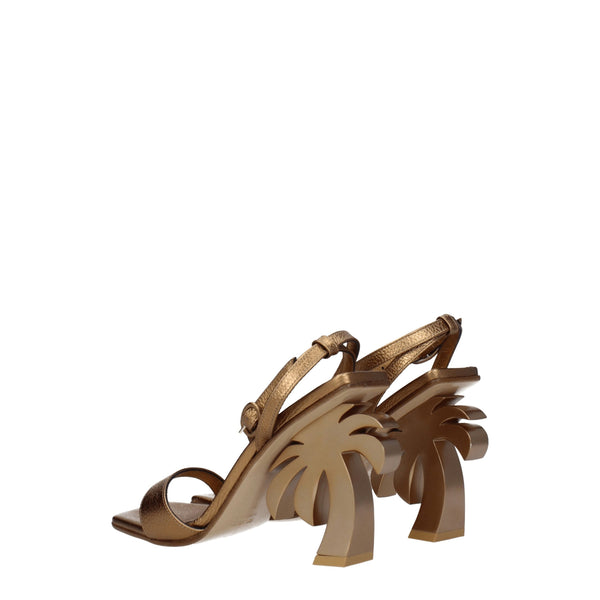 Goldene Ledersandalen mit Plateauabsatz