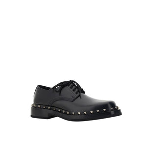Schwarze Oxford- und Derby-Schuhe aus Kalbsleder