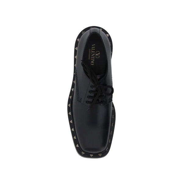Schwarze Oxford- und Derby-Schuhe aus Kalbsleder