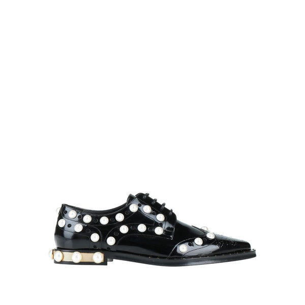 Schwarze Leder Oxfords und Derby