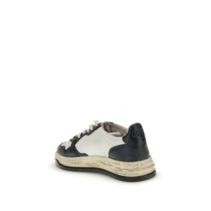 Sportliche Sneakers aus Cremefarbenem Leder