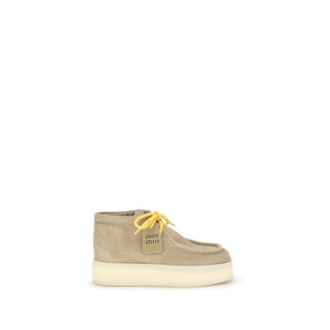 Beigefarbene Plateau-Sneaker aus Gummi