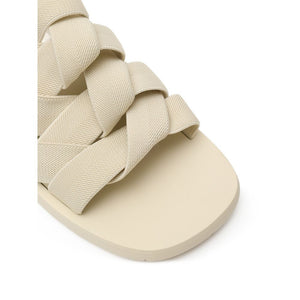 Beigefarbene Stoff-Pantoffeln
