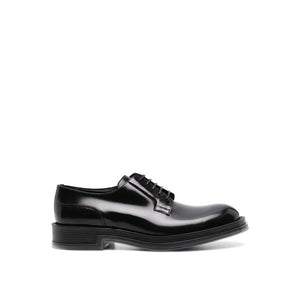 Schwarze Oxford- und Derby-Schuhe aus Kalbsleder