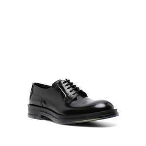 Schwarze Oxford- und Derby-Schuhe aus Kalbsleder