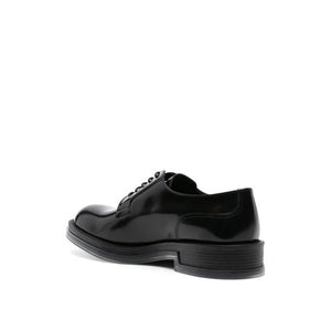 Schwarze Oxford- und Derby-Schuhe aus Kalbsleder