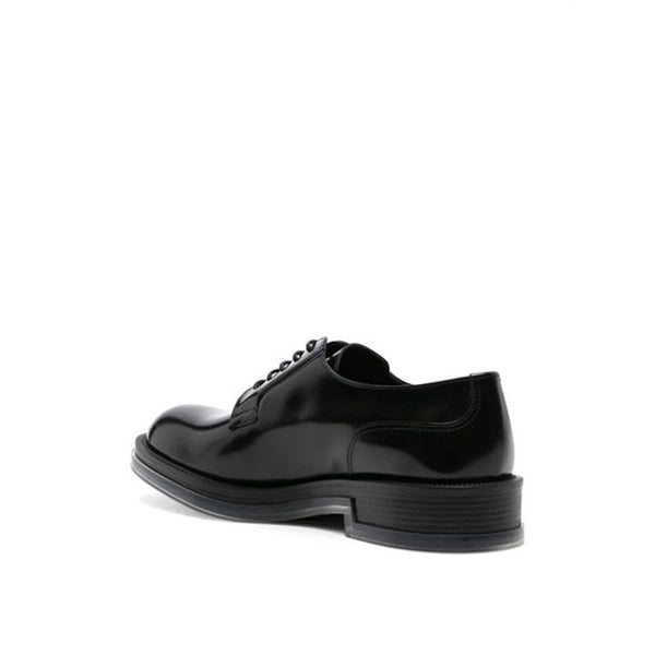 Schwarze Oxford- und Derby-Schuhe aus Kalbsleder